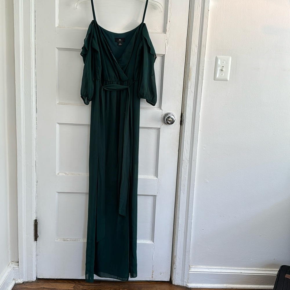 Green floor length dress worn as a bridesmaid